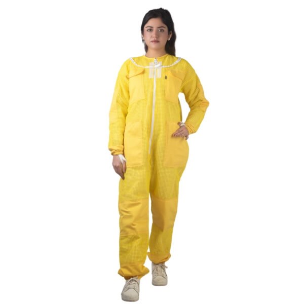 Yellow beesuit worn by a beekeeper, protective beekeeping suit with full body coverage for safe beekeeping work