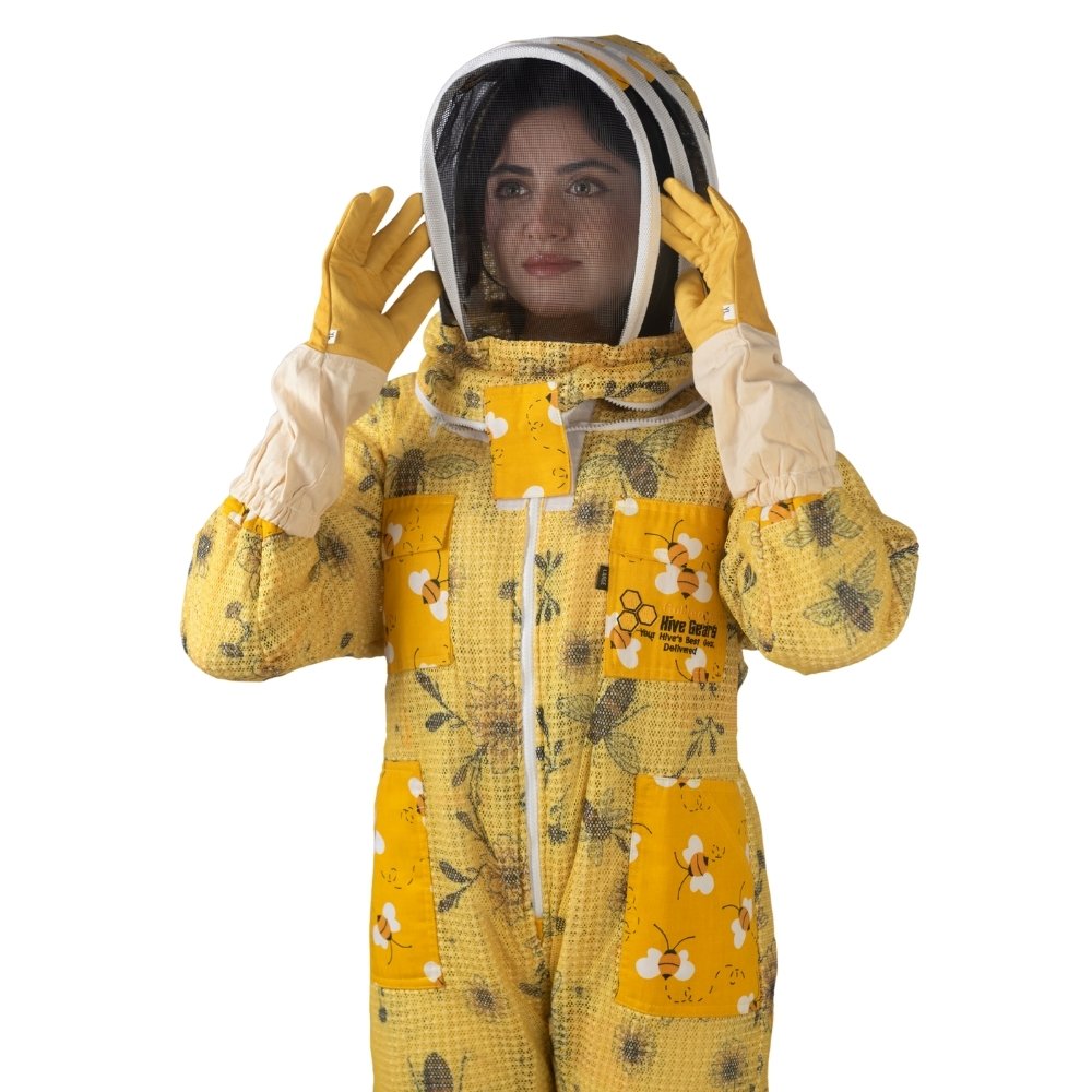 Close-up of yellow printed beesuit showing protective veil and gloves for beekeeping safety